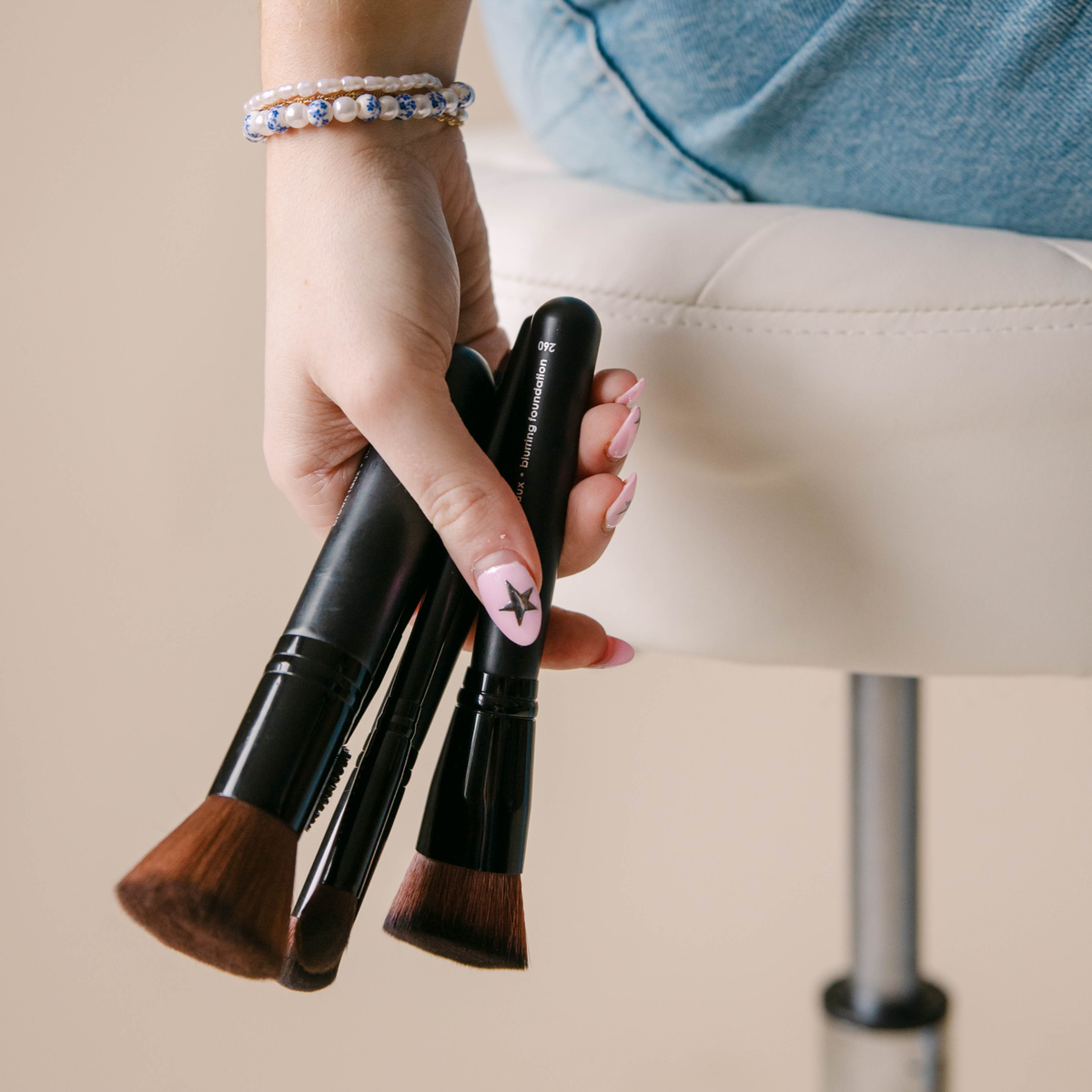 Vegan Makeup brushes in a womans hand | Taylor Made Organics