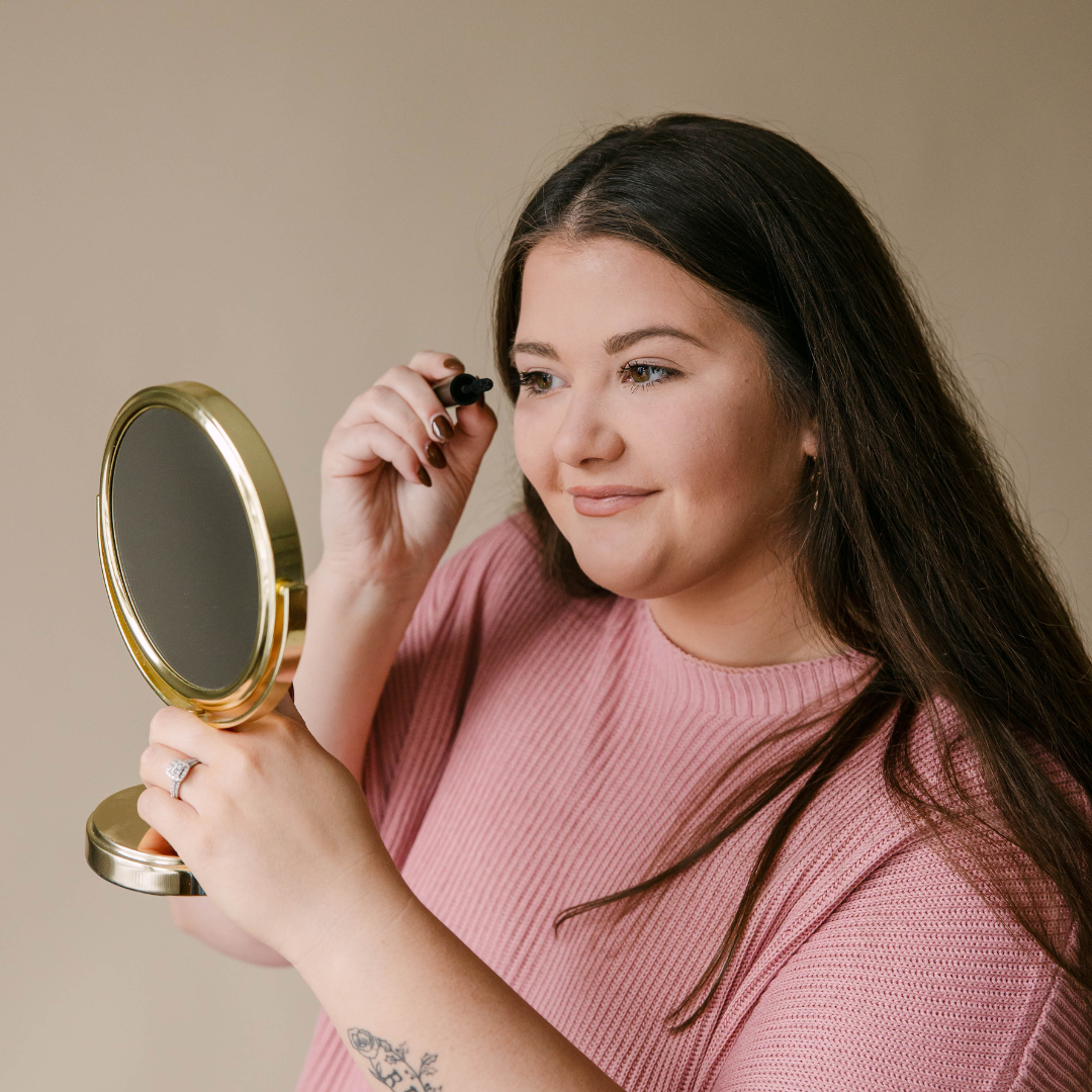 Applying mascara to promote lash growth