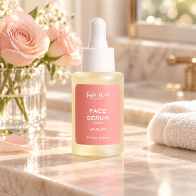 UpGlow Face Serum made with Castor Oil and Hyaluronic Acid sitting on a granite countertop beside a vase of fresh roses. Made in the USA with toxin-free ingredients.